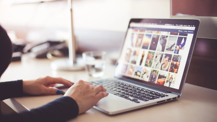 woman scrolling on a laptop woman scrolling on a laptop