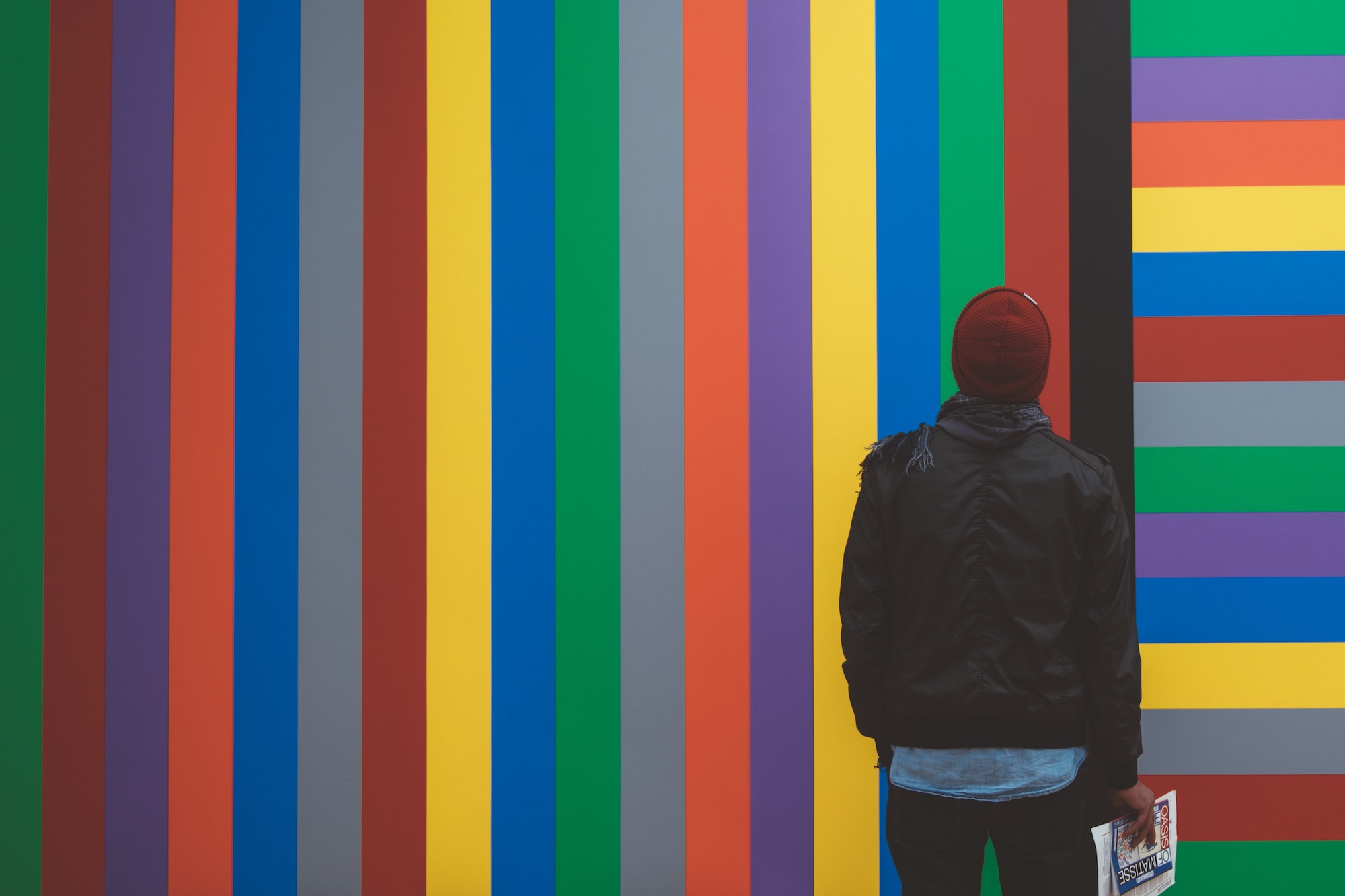 person-looking-colorful-wall person-looking-colorful-wall
